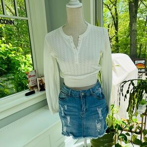 Pretty pointelle sweater and distressed denim mini skirt